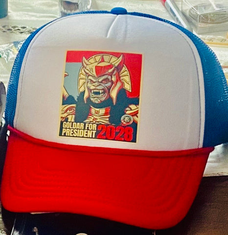 SUCIOWEAR OFFICIAL “Goldar for President” Red/White/Blue Foam Trucker Cap